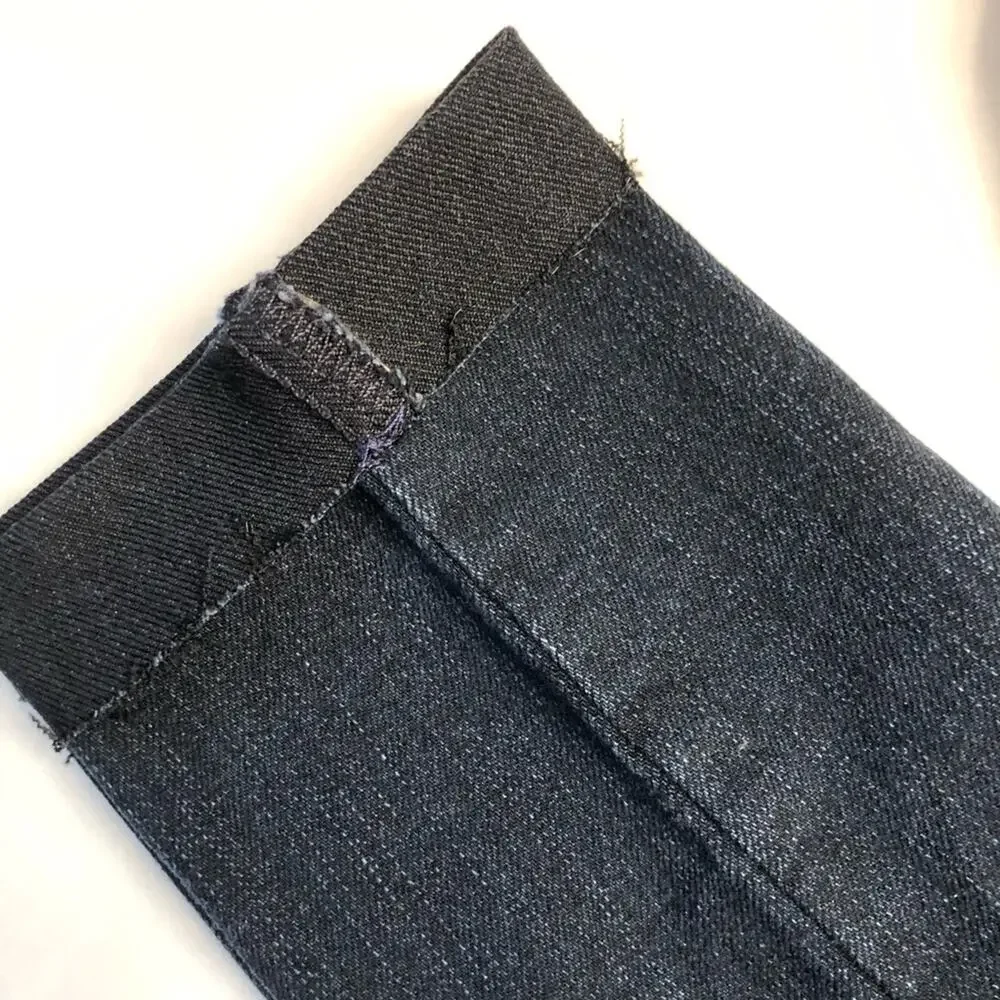 Michael Kors Blue jeans with raw edge folded hem tapered stretch. Size 4.
